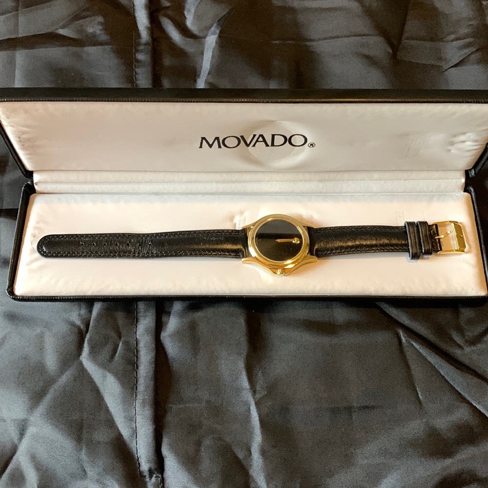 Men’s Gold/Black Movado wrist watch with case